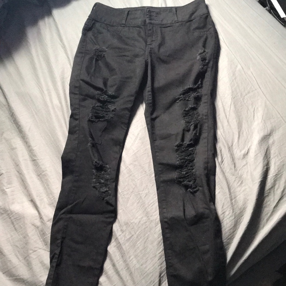 Distressed black skinny jeans